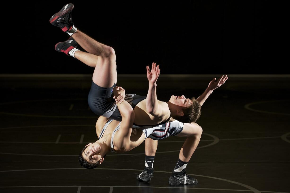 Junior Godinho, lower left, not only needed the help of his father, coach John Godinho, but his teammates, like Daniel Rice (pictured here), to capture the Class 4A state wrestling championship at 132 pounds.