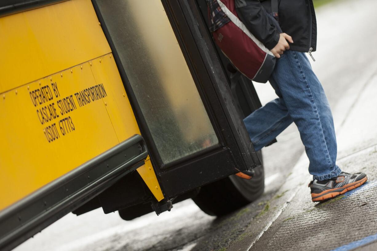 A student gets off the bus at Hockinson Heights Elementary School in 2010.