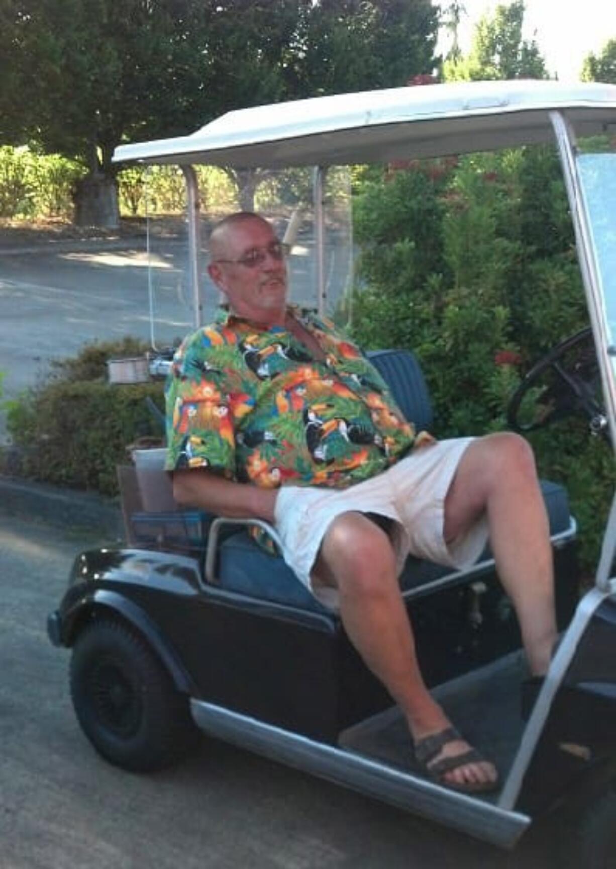 Northfield: Northfield condo owner Ed Malcom sits in his golf cart, which he uses to get around when he volunteers to help spruce up the community.