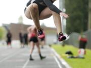 Union's Tayler Troupe competes in the long jump at Camas High School, Tuesday, April 22, 2014.