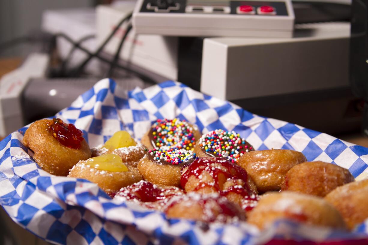 Made-to-order mini-doughnuts, Paper Tiger coffee, and organic teas are the specialties of the house at Echo Donut Lounge.