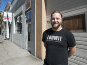 Devon Bray, co-owner of Loowit Brewing, stands in front of his business in downtown Vancouver.