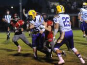 Columbia River quarterback Garrett McKee scores a touchdown against R.A. Long  in Longview.