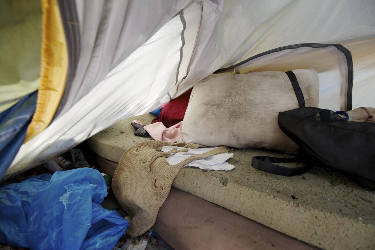 A homeless person presumably slept inside this tent along the banks of Tenney Creek off Highway 99 in Hazel Dell before abandoning the site.