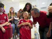 Mallory Stonier gets the good news while she's at the McDonald's on Mill Plain with her mom Monica Stonier, dad Brandon Stonier and her east Vancouver soccer team.