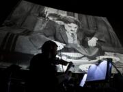 Washington Chamber Orchestra violinist Brian Bennet helps perform the background music Sunday for Charlie Chaplin's silent film &quot;The Gold Rush.&quot;