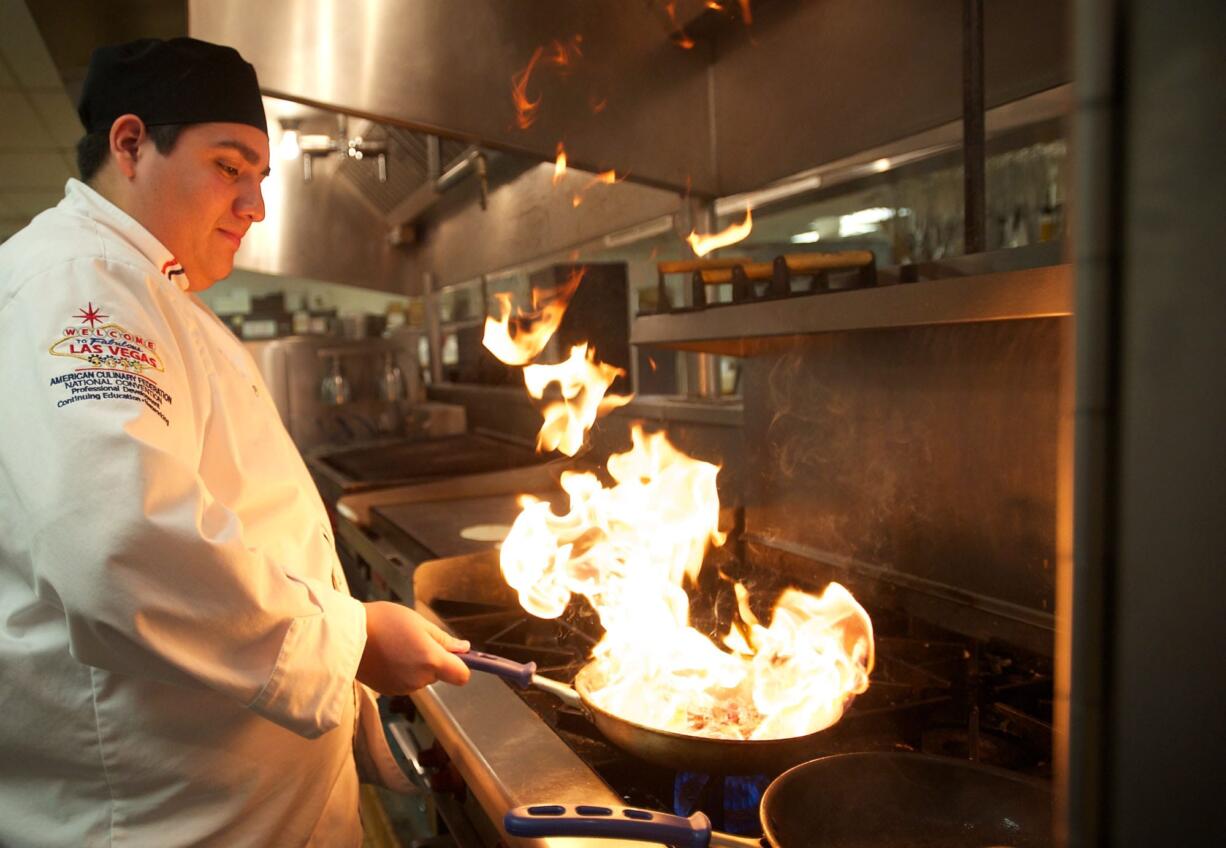 Clark County Skills Center sous chef Gerald Morales sautes beef for chipotle Baja tacos. On a recent trip to Las Vegas, Morales introduced himself to the executive chefs at two iconic restaurants, Lagasse's Stadium at the Palazzo and Restaurant Guy Savoy in Caesars Palace.