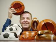 John Wirth, president and CEO of Remarkabowl, shows off some of his products at his company headquarters.