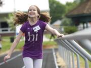 Sofia Batchelor, 10, of Vancouver runs the 100 meters at the Washington State School for the Blind track meet. &quot;Sometimes I feel like I'm flying.