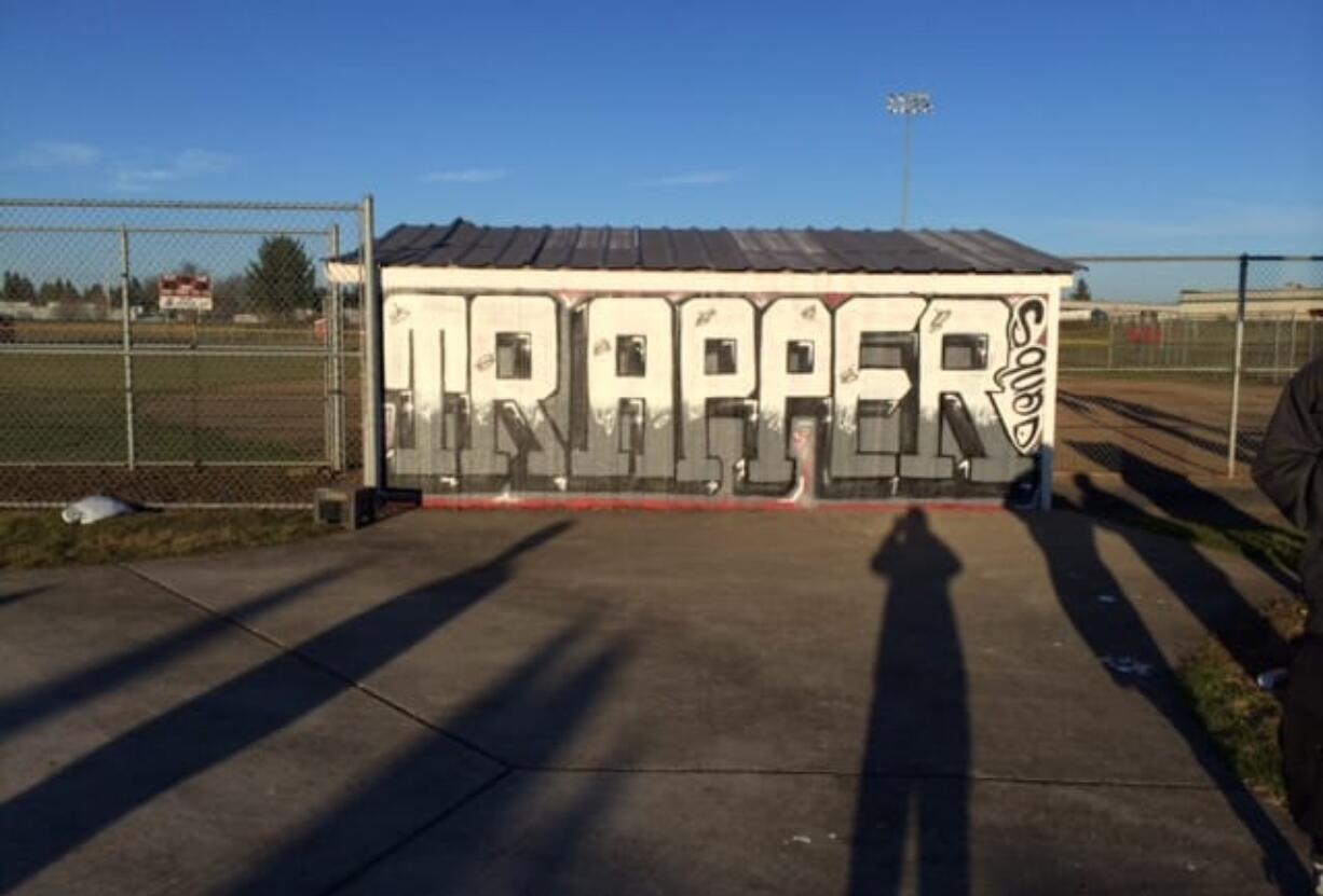 Fort Vancouver High School students finished a &quot;Trapper&quot; mural Sunday on the dugout at the softball field.