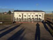 Fort Vancouver High School students finished a &quot;Trapper&quot; mural Sunday on the dugout at the softball field.