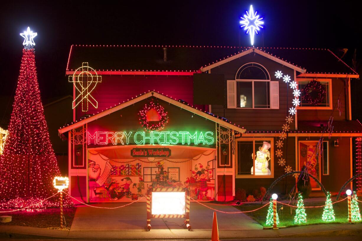 Brandon Whitehead's Christmas light display includes a cross and cancer-awareness ribbon that are a tribute to his mother.