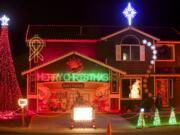 Brandon Whitehead's Christmas light display includes a cross and cancer-awareness ribbon that are a tribute to his mother.