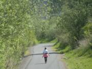 Roberta Marques Reis walks on the Burnt Bridge Creek Trail in Vancouver on Monday.