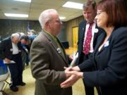 Ed Barnes, from left, Craig Pridemore and Kelly Love Parker congratulate each other after the Clark County Democrats selected and ranked them in March as their top three candidates in the order of Pridemore, Parker and Barnes, to fill the commissioner seat vacated by Steve Stuart.