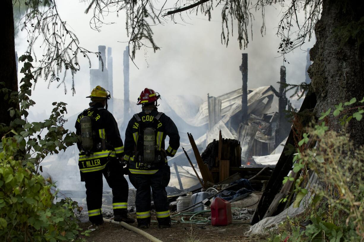 Firefighters from Clark County Fire and Rescue, Vancouver Fire and Clark County Fire District 3 battle a shop fire at 12100 N.E.