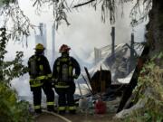 Firefighters from Clark County Fire and Rescue, Vancouver Fire and Clark County Fire District 3 battle a shop fire at 12100 N.E.