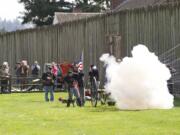 Re-enactors at Fort Vancouver fired a howitzer Thursday during a commemoration of the 150th anniversary of the Civil War surrender of General Robert E.