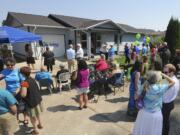 About 50 guests, donors and volunteers gathered for Sunday's dedication of the 30th local Habitat for Humanity home.