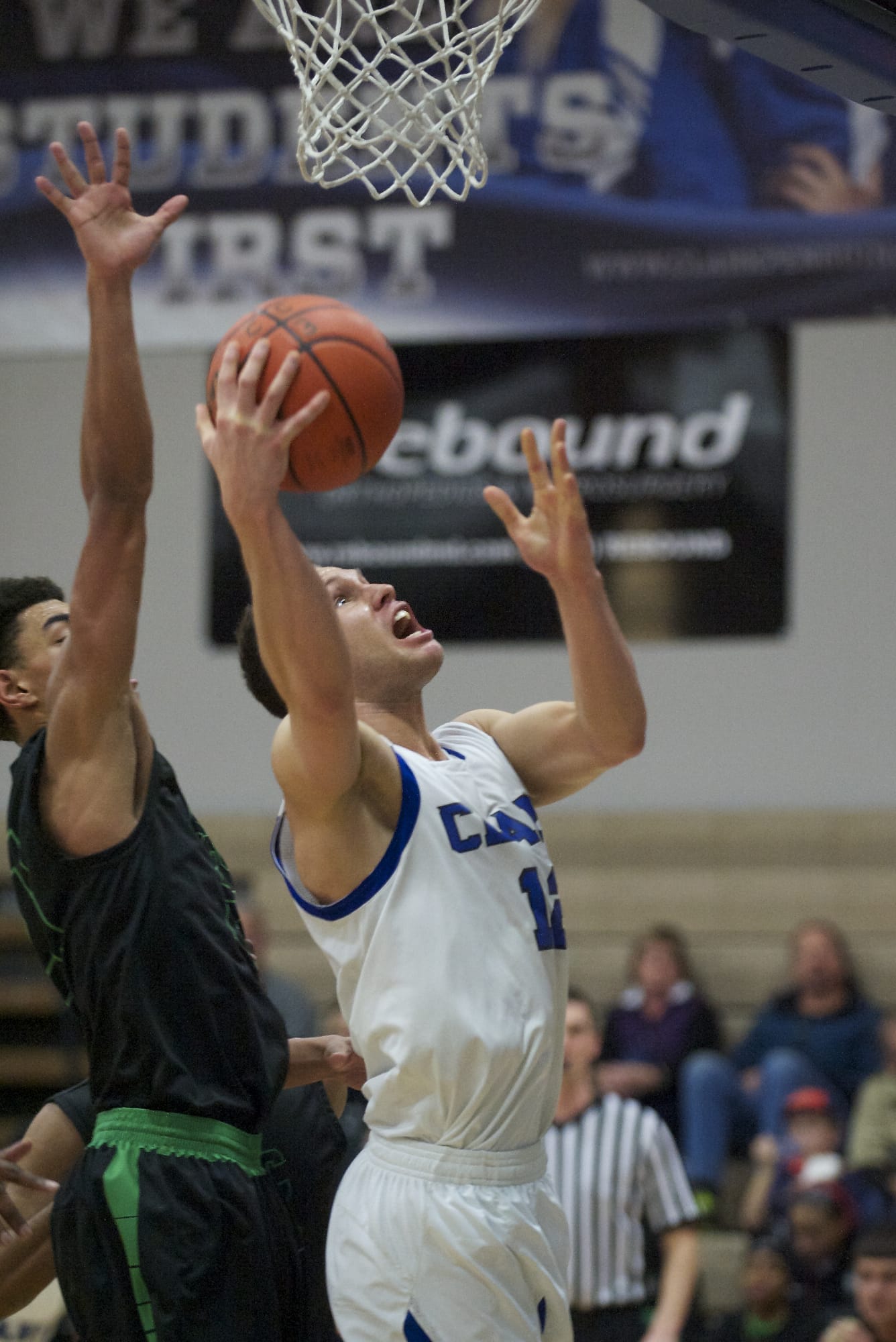 Clark's Sean Price takes the ball to the hoop in the first half against Highline on on Saturday.