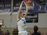 Clark's Collin Spickerman throws down a dunk in the first half against Highline on Saturday.