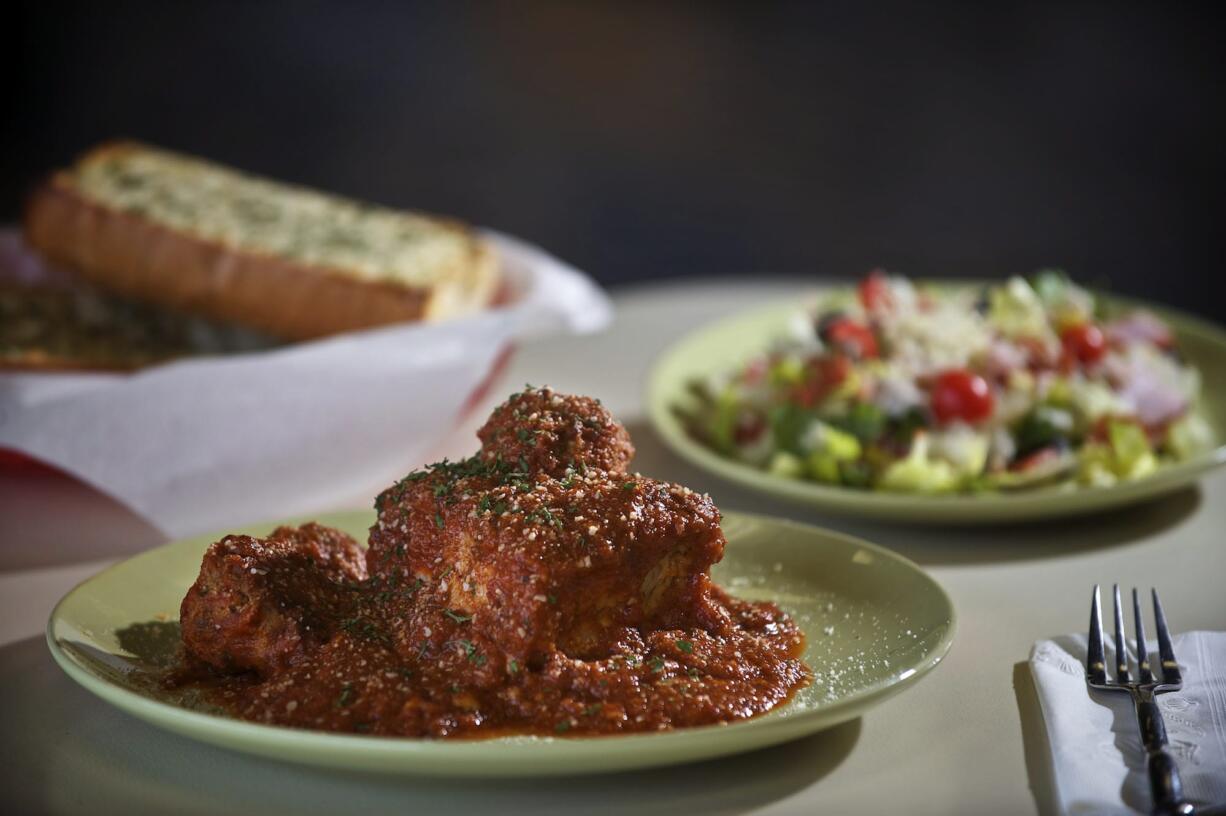 The lasagna with meatballs, garlic cheesy bread and antipasto salad are served at Dominik's Italian restaurant in Vancouver.