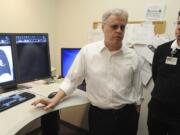 Radiologist William Kuhle, left, and Dr. Michael Myers, a radiation oncologist, discuss a new lung cancer screening program to roll out next month at PeaceHealth Southwest Medical Center in Vancouver. The program will follow the first lung cancer screening recommendations implemented in the U.S.