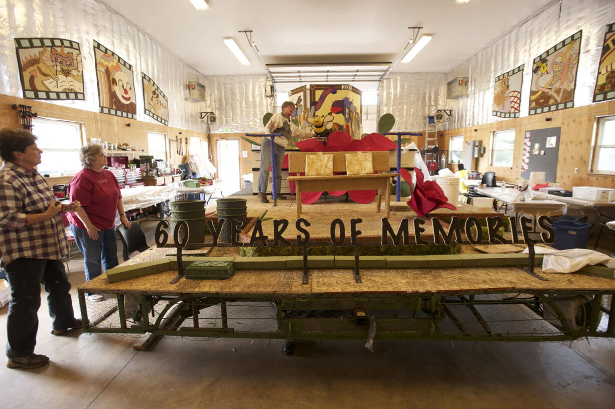 Battle Ground is celebrating its 60th year in the Rose Festival Parade. Volunteers build the 2014 float, Thursday, May 29, 2014.