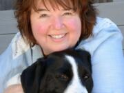 Vancouver watercolorist Bev Jozwiak and one of her favorite subjects, 75-pound border collie Chumlee.