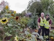 Neighbors On Watch volunteers Andy Chumbley and Ann Glidewell were among the volunteers who have stepped up patrols around the Arnada Community Garden in Vancouver to help deter criminal activity.