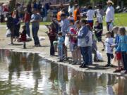 Photos by Steven Lane of The Columbian
Kids of all ages drop a line during the Klineline Kids Fishing Derby Saturday at Klineline Pond in Vancouver.