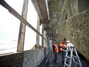 Catworks Construction foreman Patrick Bachmeier, left, and project manager Doug Stetler stand under the Benson Bridge at Multnomah Falls on Tuesday.