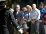 Zachary Kaufman/The Columbian
Vancouver Fire Capt. Perry LeDoux rings a bell to honor those who were lost on Sept.11, 2001.