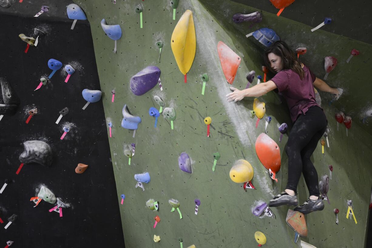 Taylor Anderson climbs a rock wall at The Circuit Bouldering Gym in Tigard, Ore. Anderson and other climbers from Clark County will be among more than 400 climbers from 17 states to compete Saturday in the Portland Boulder Rally, which is billed as the largest single-day bouldering competition in the United States.