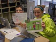 Ridgefield: South Ridge Elementary School sixth-graders Jacob Thompson and Grace Melbuer show off how they used skills they picked up in advanced math class to enlarge drawings to scale.