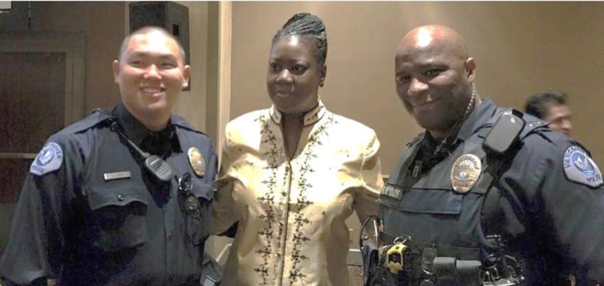 Portland: Sybrina Fulton, the mother of Trayvon Martin, with two Vancouver Police Department officers after she spoke at the 23rd Annual Inspire Luncheon for the YWCA of Greater Portland on April 14.