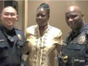 Portland: Sybrina Fulton, the mother of Trayvon Martin, with two Vancouver Police Department officers after she spoke at the 23rd Annual Inspire Luncheon for the YWCA of Greater Portland on April 14.