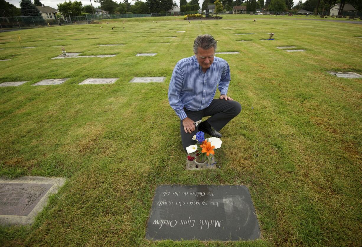 Ridgefield Mayor Ron Onslow visits the grave of his eldest daughter, Michele, at St. James Acres Catholic Cemetery in Vancouver.