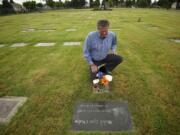 Ridgefield Mayor Ron Onslow visits the grave of his eldest daughter, Michele, at St. James Acres Catholic Cemetery in Vancouver.