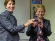 Hudson's Bay: Mary Blanchette, left, executive director of the Children's Justice Center, presents the center's Star Award to Gerry Dowdy Latshaw, managing principal broker for Windermere Stellar, for her fundraising efforts and support.