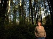 Norma Countryman stands on April 9 in the spot east of Battle Ground where she says she was tied to a tree after Warren Forrest abducted her. Suspected of being a serial killer, Forrest had a parole hearing in February.