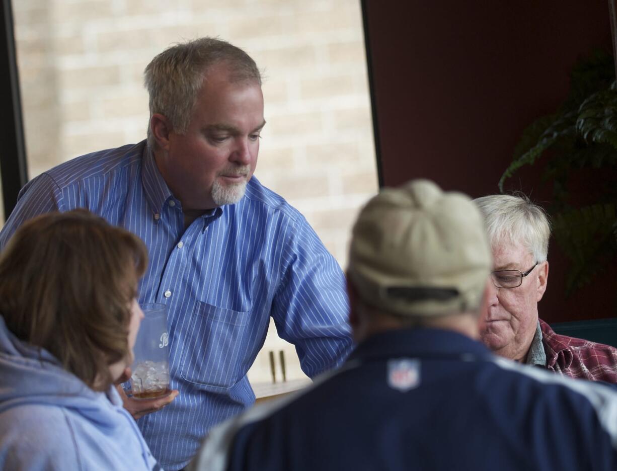 Mill Creek Pub owner Russell Brent works in the dining room of the Battle Ground restaurant in January.