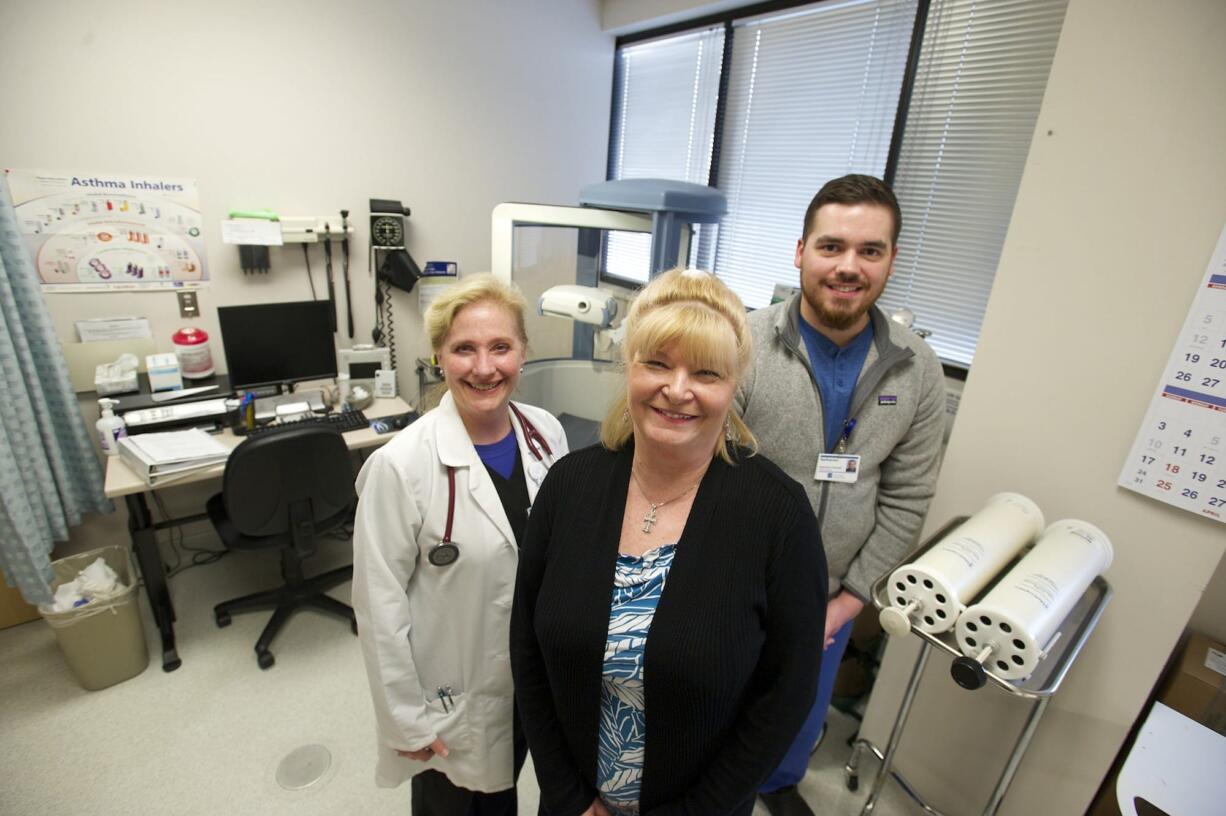 Tiffany Aplet, center, has been working to manage her chronic obstructive pulmonary disease with the assistance of a new COPD clinic at PeaceHealth Medical Group Pulmonary.