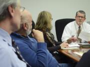 Clark County Administrator Mark McCauley, right, attends a finance committee meeting Tuesday afternoon with county employees, from left, Mark Gassaway, Bob Stevens and Laura Pedersen. Earlier Tuesday, McCauley accepted an offer from county commissioners to be acting county manager.