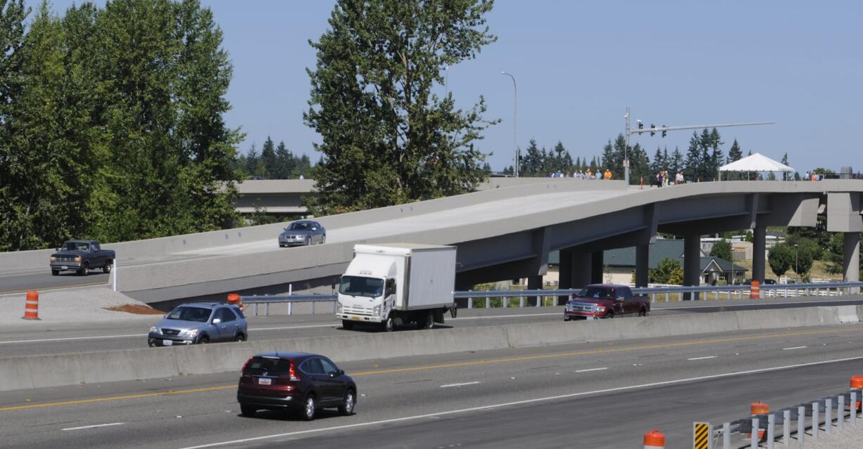 Cars use the new ramp to I-5 after WSDOT opens the new freeway interchange and the NE 139th Street bridge with a ribbon cutting at Salmon Creek in Vancouver  Wa., Wednesday August 27, 2014.