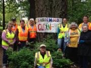 Maple Tree: Members of the Maple Tree Neighborhood Association celebrate cleaning up trash along Covington Road with a potluck April 26 at Orchards Park.