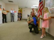 Skamania: Lilly Johnson, 8, from Skamania, is awarded May 1 by Skamania County Sheriff Dave Brown for her courage after reporting finding the body of a Vancouver woman in the Columbia River at Beacon Rock State Park.