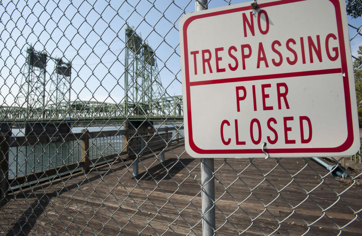 The fishing pier, just east of the Interstate 5 Bridge, stands closed and in disrepair.