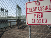 The fishing pier, just east of the Interstate 5 Bridge, stands closed and in disrepair.