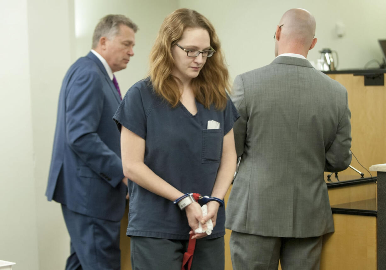 Stephanie McCrea, a former Evergreen High School drama teacher, walks back to a holding area for jail inmates after being sentenced Wednesday to five years in prison.